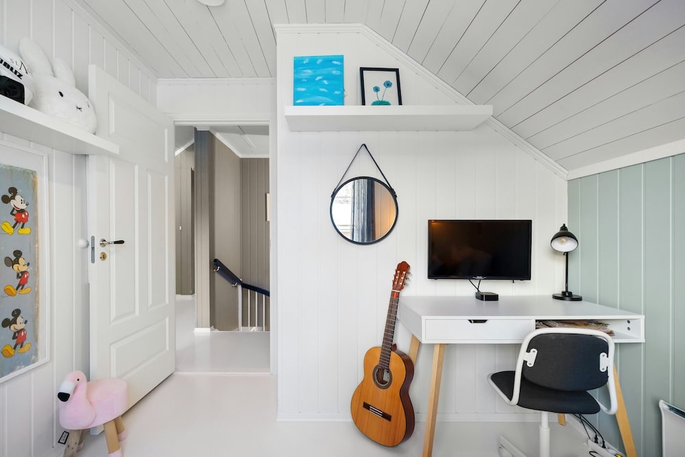small child's room with desk and blue wall