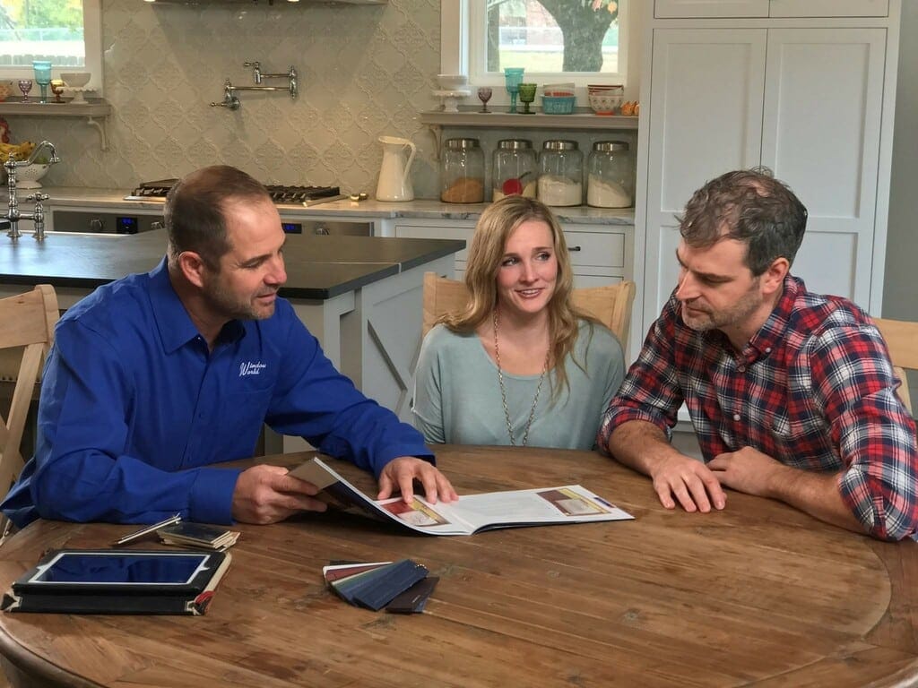 Window World sales consultant meeting with a couple for their free in-home estimate.