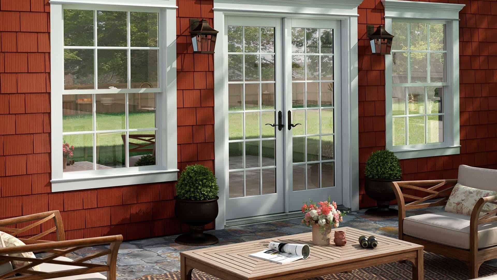 home with patio door and shakes and scallops